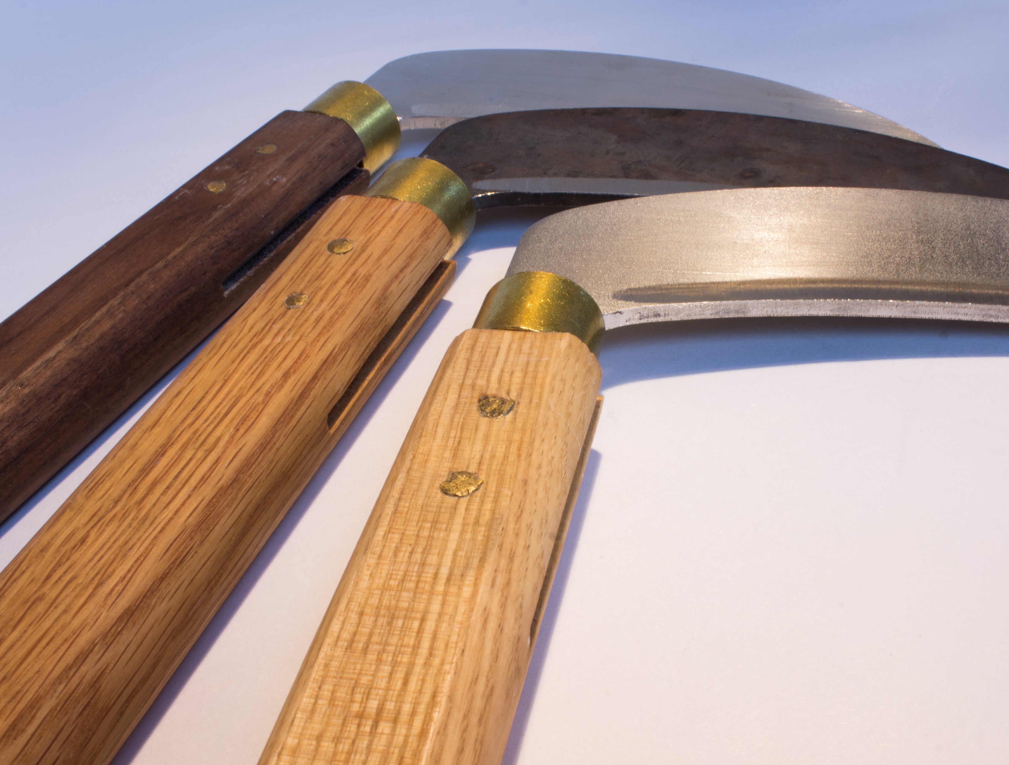 (right) ash & untreated steel, (centre) oak & heat-treated steel, (left) walnut & aluminium.